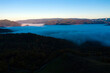 Aerial view of mist and clouds in the valley in sunrise