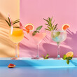 Refreshing cocktails in elegant glass is adorned with carefully crafted fruit garnishes and herbs, set against a dual-tone pastel background