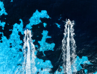 Wall Mural - vacation and leisure. aerial view on fast boats on blue mediterranean sea at sunny day. fast ships o