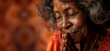 Old black christian woman praying and smiling.