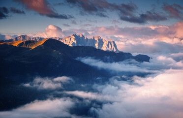 Sticker - A gorgeous view of rocky peaks surrounded by fog. Italian Alps, Dolomites, South Tyrol, Europe.