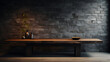 a wooden table with dark brick wall behind it