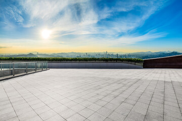 Wall Mural - Empty square floor and modern city skyline with mountains