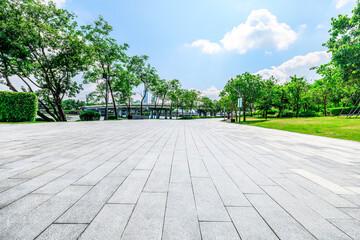 Wall Mural - Empty square floor and trees with buildings in park