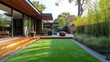 Beautiful backyard oasis featuring artificial grass, wooden decking, and a cozy seating area for outdoor relaxation and entertaining