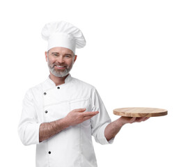 Poster - Happy chef in uniform pointing at wooden board on white background