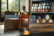 Mock-up of whisky bottle standing on a wooden table in the room