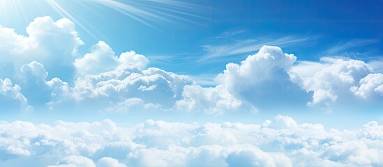 Wall Mural - A serene image of the sky featuring the sun shining brightly amidst fluffy white clouds