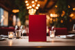 Red menu on the table in the restaurant with blurred background. Design template or mockup with copyspace