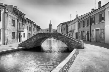 Canvas Print - Walking among the picturesque canals of Comacchio, Italy