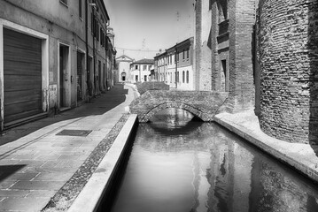 Canvas Print - Walking among the picturesque canals of Comacchio, Italy