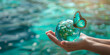 Women's hands holding green planet w/ butterfly drinking potable water from globe on turquoise blue color water background. generative ai