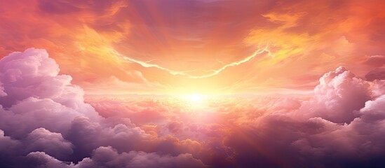 Wall Mural - the suns amber glow shines through the clouds in the red sky at dusk, creating a beautiful natural l