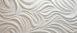 Detailed view of a wall surface showcasing intricate white design elements and patterns