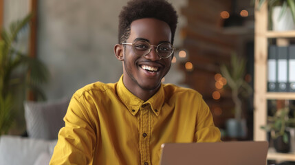 Canvas Print - A cheerful individual with glasses smiles in a casually styled apartment.