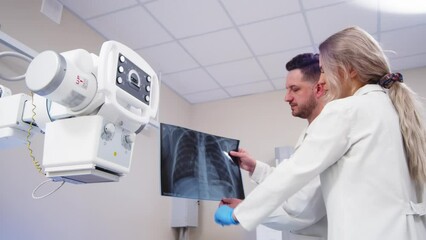 Sticker - Specialists consult in the X-ray room. Lung diseases, inflammation and colds after Covid. Medical coaching and collaboration to achieve patient outcomes.