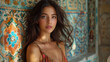 © Daniel - A pensive young woman with dark hair poses against a vibrant backdrop of traditional Moroccan tiles