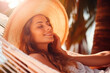 Happy traveler woman with hat relax in hammock on beach shadow of palm leaf, sunlight
