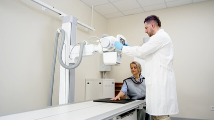 Sticker - A specialist radiologist doctor installs an x-ray scanner for a patient. Medical research, injury and treatment concept.