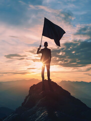 Sticker - A man is standing on a mountain holding a flag. The flag is black and white. The man is looking up at the sky. The sky is cloudy and the sun is setting. Concept of accomplishment and pride