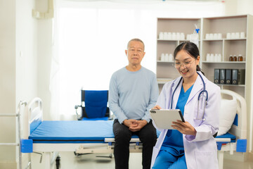 A nurse in charge takes care of a senior man to sleep in a room at the hospital department. Asian female doctor talking with male patient on bed about his pain and symptoms, life insurance concept