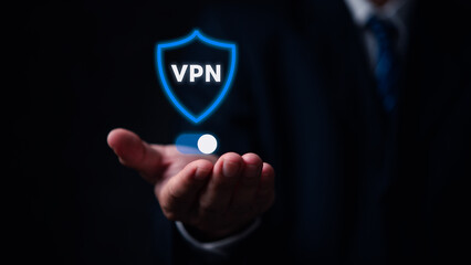 Wall Mural - A man is holding a pill in his hand and the word VPN is displayed in blue