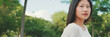 © Andrii Nekrasov - Beautiful brunette girl is resting sitting on bench in city park, looking around, Panorama
