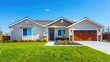 © rimsha - Beautiful ranch style home exterior on a bright sunny day with blue sky.