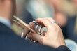 Details of hands playing the trumpet