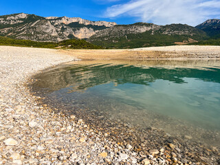 The Lake of Sainte-Croix (French: Lac de Sainte-Croix) with the Verdon Gorge in the background in Provence, France