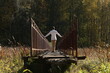 Young man in white shirt walking on the narrow bridge. Photo was taken 24 September 2023 year.