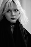Fototapeta Konie - Portrait of a young beautiful blonde girl in black and white style.