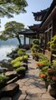Lakeside Chinese style architecture with a stone slab walkway and lush greenery