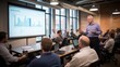 © Molang Visual - Businessman giving a presentation to a group of people in a conference room