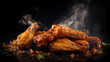 A plate of crispy chicken wings with a lot of smoke coming from them. The smoke is coming from a pan of hot oil