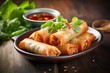Delicious spring rolls on a rustic plate against a whitewashed wood background