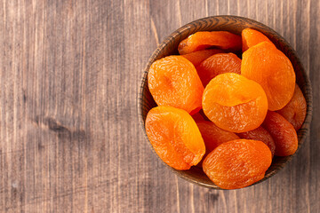 Wall Mural - Dried apricots in a bowl. Dried fruits. 