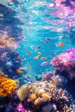 Fototapeta Do akwarium - A colorful coral reef with many fish swimming around. The fish are orange, pink, and blue