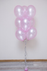 Wall Mural - pearlescent pink balloons on white background