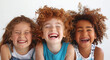  Close up portrait of 3 young children  happily laughing .  Concept of  friendship, happy childhood, fun.

