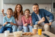 © Prostock-studio - Joyful young family with two kids playing video games at home