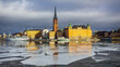 View of Historic Old Town of Stockholm, Sweden over River with Breaking Ice