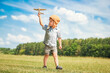 © Kostia - A Baby boy by the plane plays on nature in the park. Boy on vacation pilot.