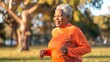 A cheerful senior woman runs energetically in a park at dawn, embodying healthy aging and positivity with her lively stride and smile.