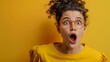 A young girl with curly hair and glasses is captured in a moment of shock against a bright yellow background, her mouth agape in a candid expression of surprise.