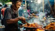 A dedicated street chef stirs a fiery pan, his focus amidst the flames reflects the vibrant energy and spicy flavors that characterize this bustling night market.