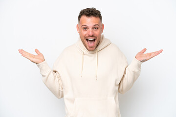 Poster - Young caucasian handsome man isolated on white background with shocked facial expression