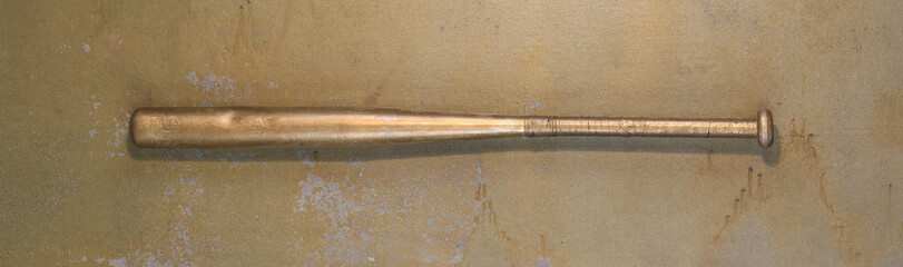 Wall Mural - golden baseball bat on old background