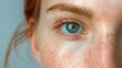 Close up of a woman's eye with freckles, perfect for beauty and skincare concepts