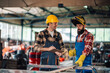© Zamrznuti tonovi - Workers in protective equipment taking measurements before grinding.